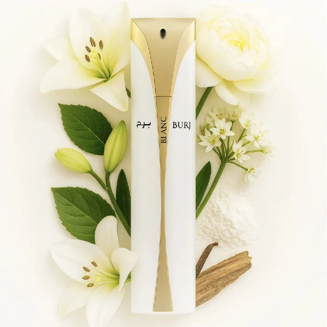 A white and gold cylindrical perfume bottle labeled 'BLANC BURI' is arranged on a white background with white flowers, green leaves, and a small vanilla bean. The product is centered and presented as a styled flat-lay.